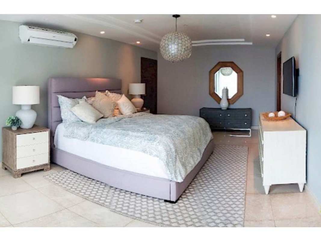 Outdoor infinity pool with lounge chairs at PH Park Lane Costa del Este Panama City