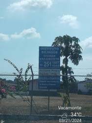 Exterior view of Vacamonte houses with arched window, planter, and light fixtures