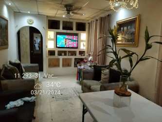 Hallway with tiled floors, decorative mirror and wood doors in Vacamonte Arraiján