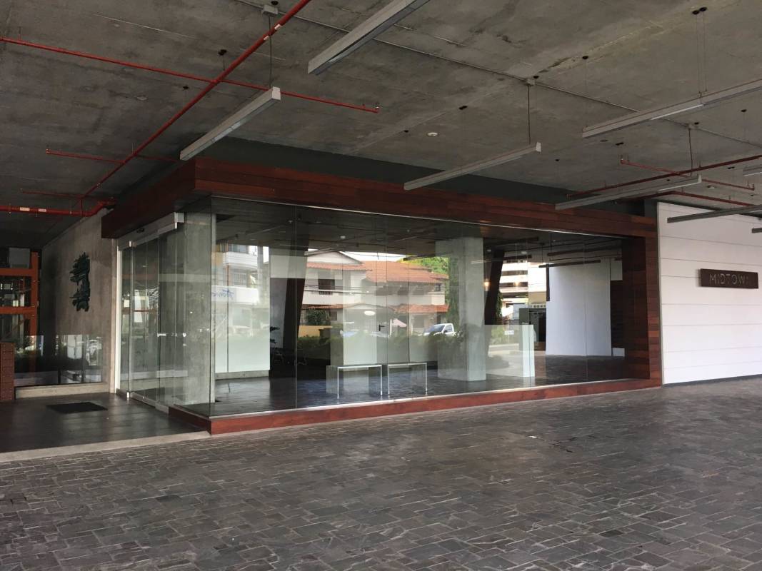 Glass storefront retail space concrete ceiling exposed pipes signage PH Midtown San Francisco Panama