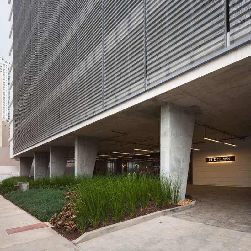 Modern mixed-use building PH Midtown with aluminum louvers exposed concrete contemporary design San Francisco Panama