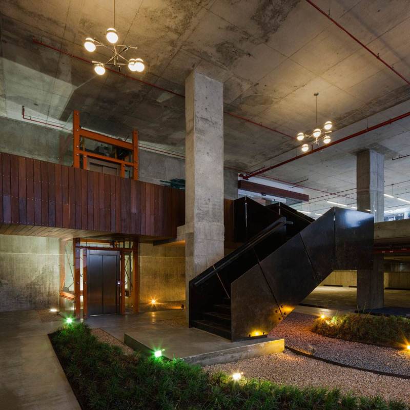 Interior lobby area with elevators, industrial design features, metal staircase in PH Midtown San Francisco Panama