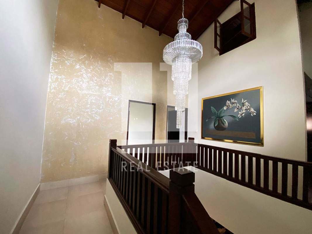 Bathroom double sinks stone wall walk-in shower large mirrors Dos Mares Panama