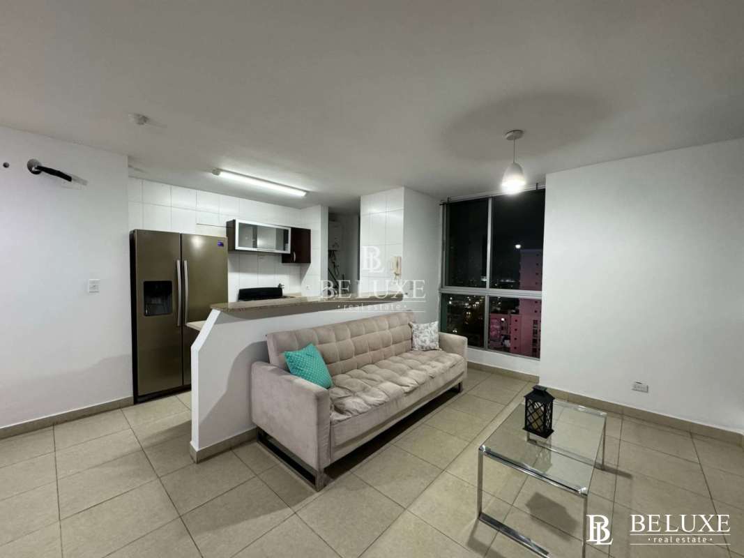 Open-plan living and dining room with large windows in PH Oasis Tower San Francisco