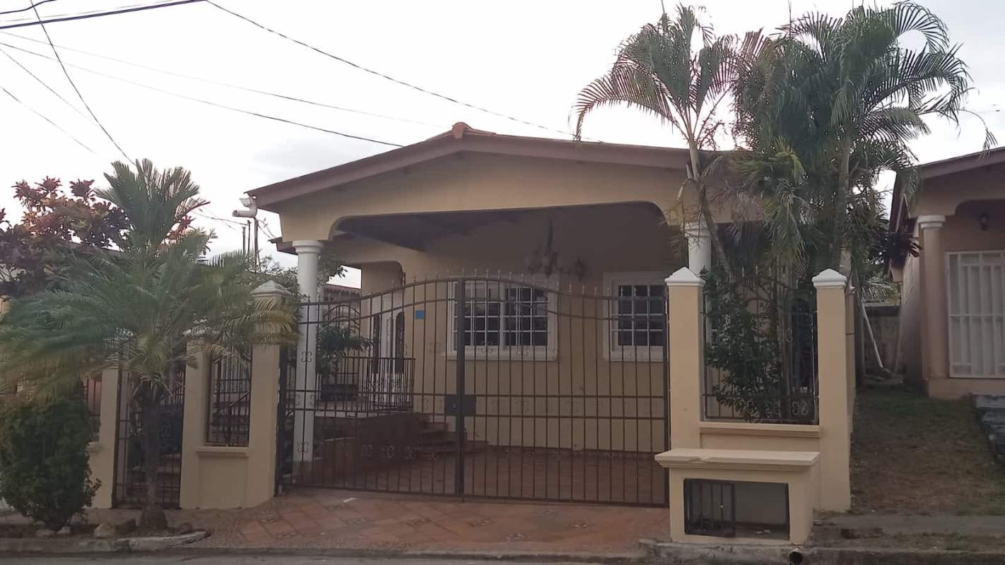 Mediterranean style facade with carport and gate in Brisas del Golf Panama City
