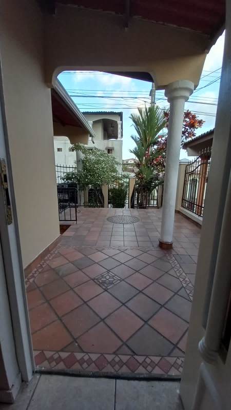 Mediterranean style entry porch with iron gate in Brisas del Golf Panama
