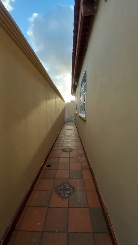 Outdoor patio with terracotta tiles in suburban house Brisas del Golf Panama