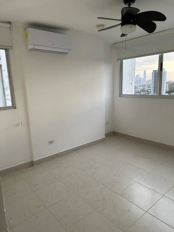 Kitchen with granite countertops, wooden cabinets, appliances PH Central Park Panama