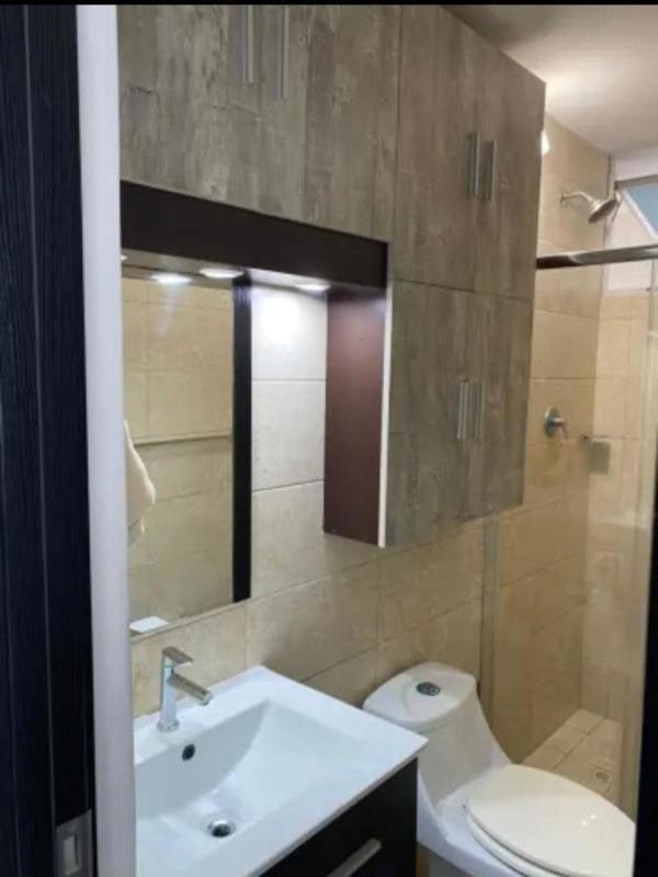 Bright second bedroom with large window and city skyline outlook PH Coral Towers Panama