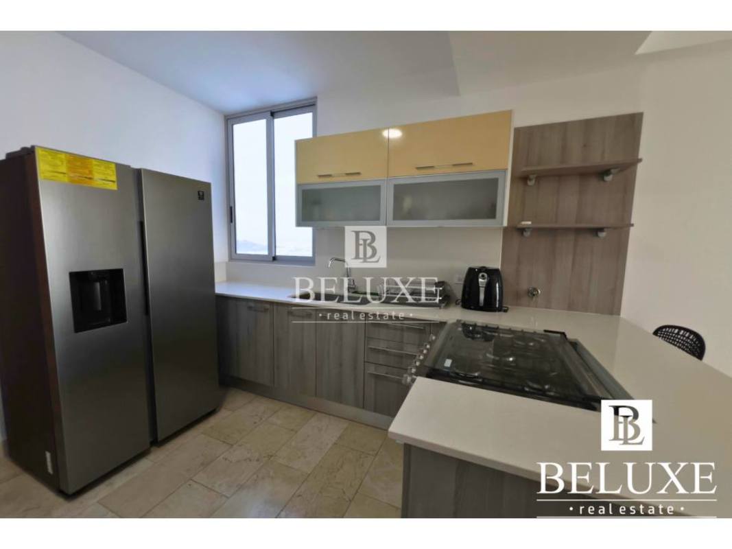 Spacious open-plan furnished living and dining area with balcony views PH Dynasty Residences Panama