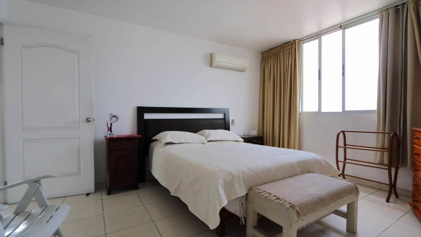 Master bedroom with walk-in closet, AC and large window view PH Montemar San Francisco Panama