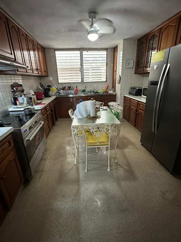 Kitchen with wood cabinetry, stainless appliances PH Las Torres La Cresta Panama City