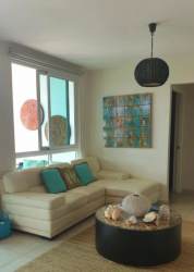 Modern coastal themed living room with sliding doors to balcony at PH Rodman Bijao Condo Panama