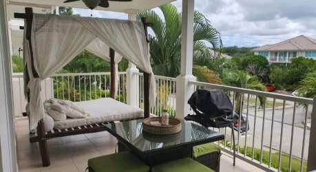 Balcony area with canopy swing bed, grill and tropical views PH Rodman Bijao Panama