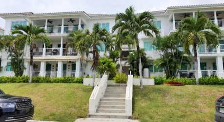 Tropical style multi-story condo building with balconies in Bijao Beach Residences Panama