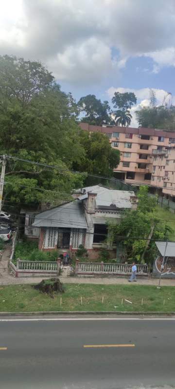 Traditional single-story house and commercial buildings on commercial-zoned lot in El Cangrejo Panama ready for renovation or development