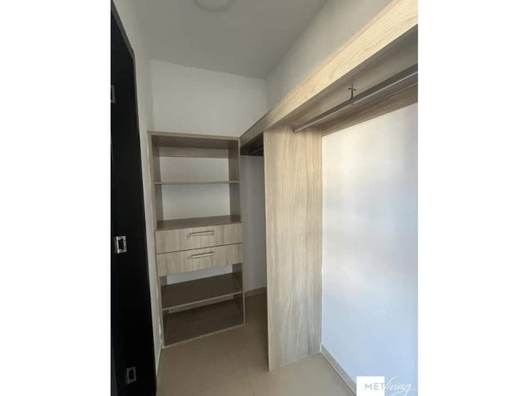 Built-in light wood closet with drawers and shelves in Altos del Crisol house Villa Lucre Panama