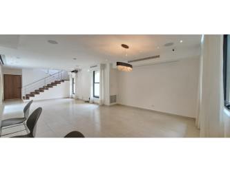 Covered outdoor terrace overlooking garden and trampoline in PH Nativa Panama Pacifico