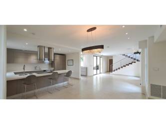 Open living dining space with large windows, natural light and garden view in Panama Pacifico