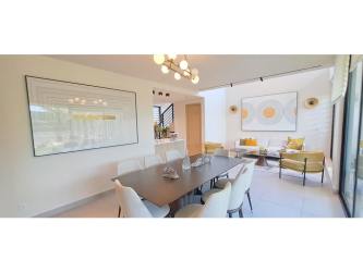 Sustainable house with bright open-plan living and dining area at IMATERRA Panama Pacifico