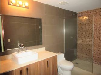 Covered terrace balcony overlooking gardens in River Valley Panamá Pacífico investment condo