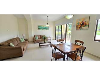 Open dining and living area with balcony access Panama Pacifico condo