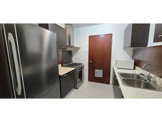 Spacious bedroom with blackout blinds and AC overlooking green areas in Panama Pacifico