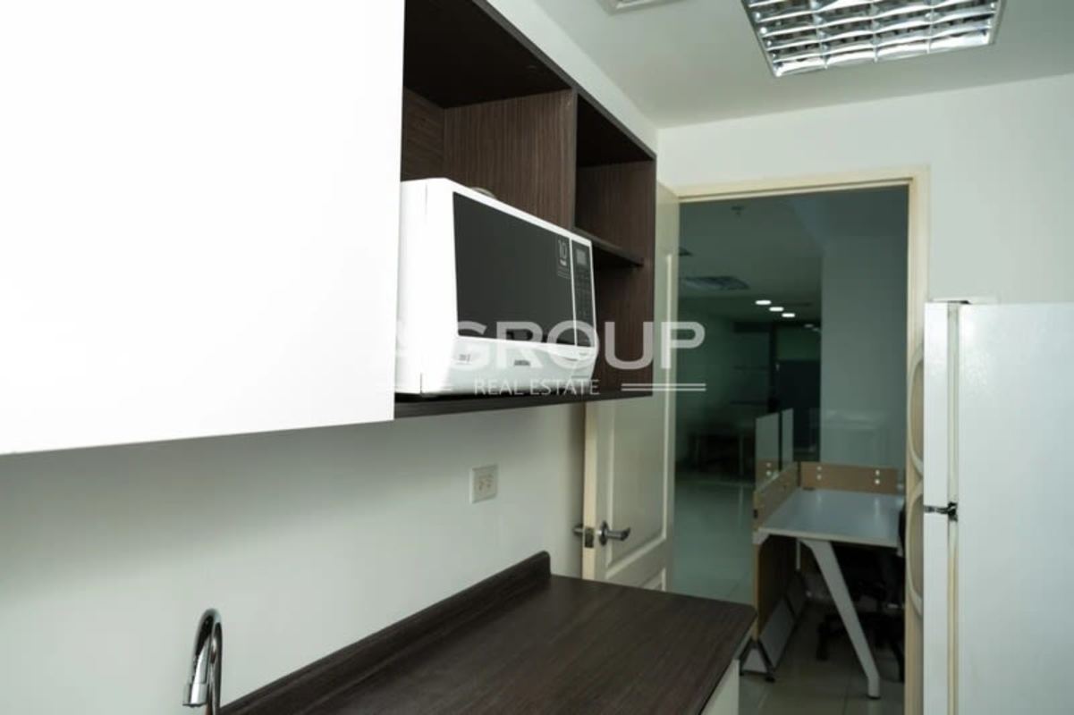 Modern bright workspace with partitions, desks and mesh chairs PH BICSA Financial Panama