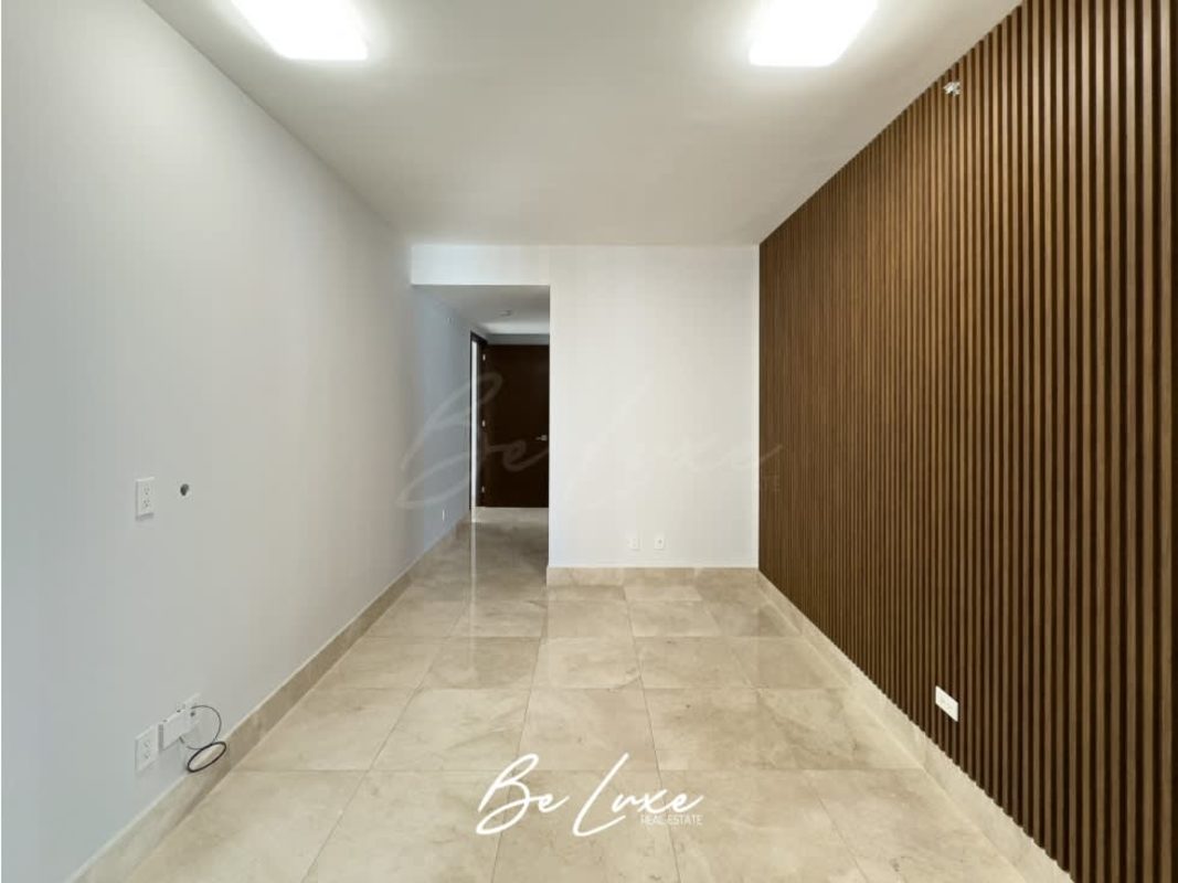 Large Olympic-size swimming pool surrounded by lounge area at PH Green Garden Santa María