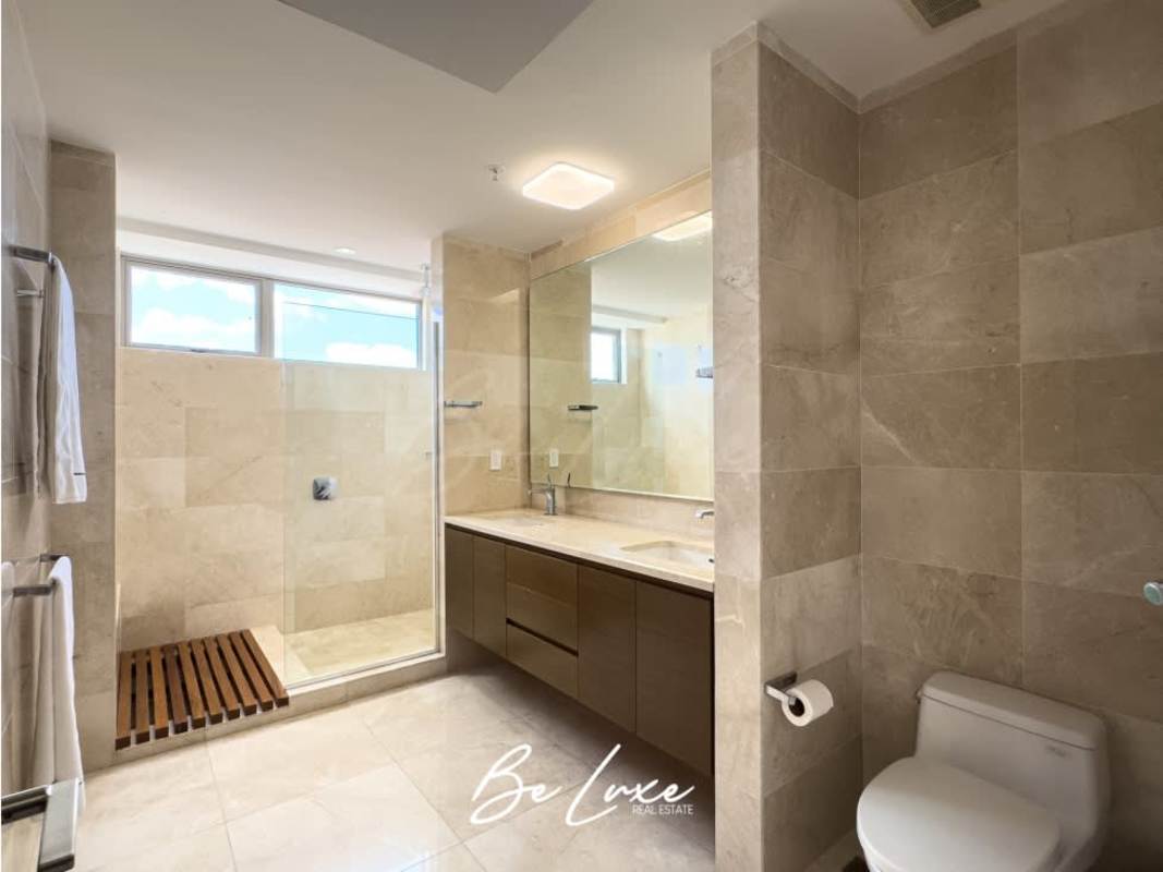 Modern bathroom with marble finishes, glass shower enclosure, premium fixtures in PH Green Garden Santa María Panama