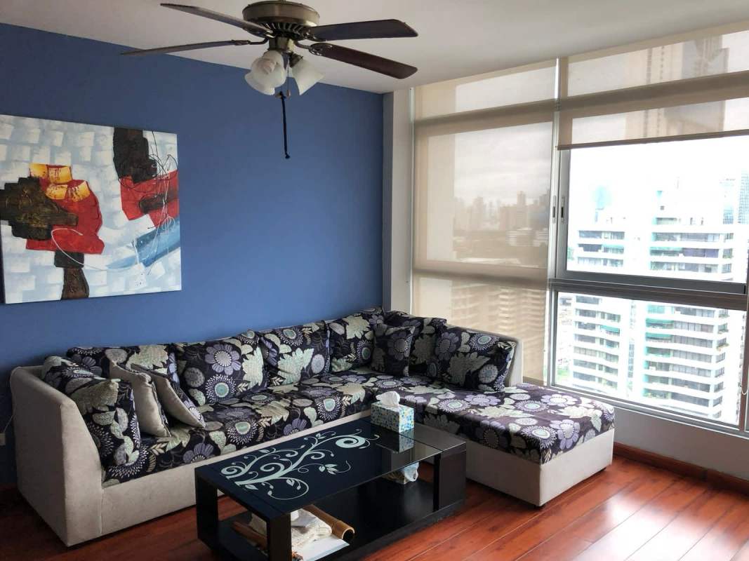 Bedroom with large window showing ocean view at PH Bayfront Tower Avenida Balboa Panama City