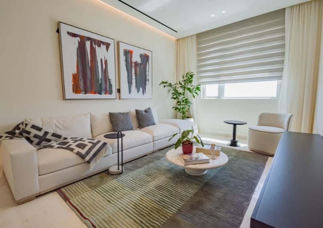 Living area with full-length windows offering ocean view in PH Almar Ocean Reef Panama