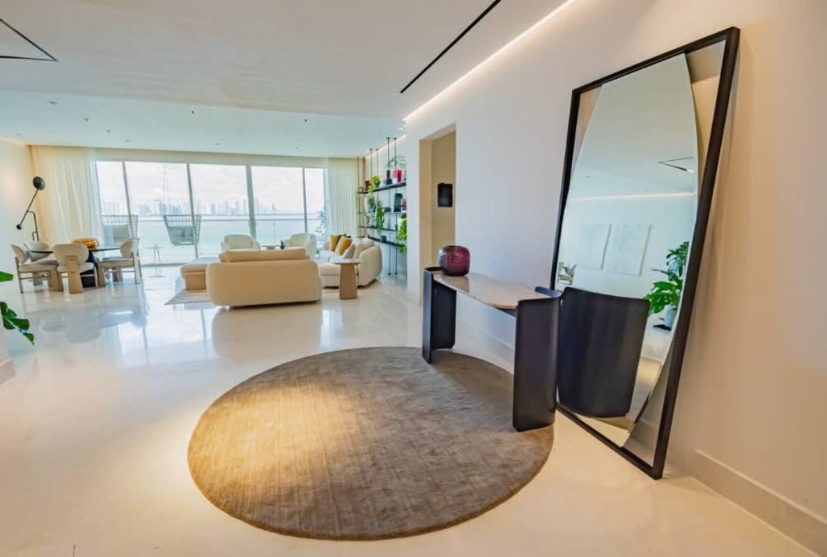 Spacious open living dining with floor-to-ceiling windows and ocean views in PH Almar Ocean Reef Panama