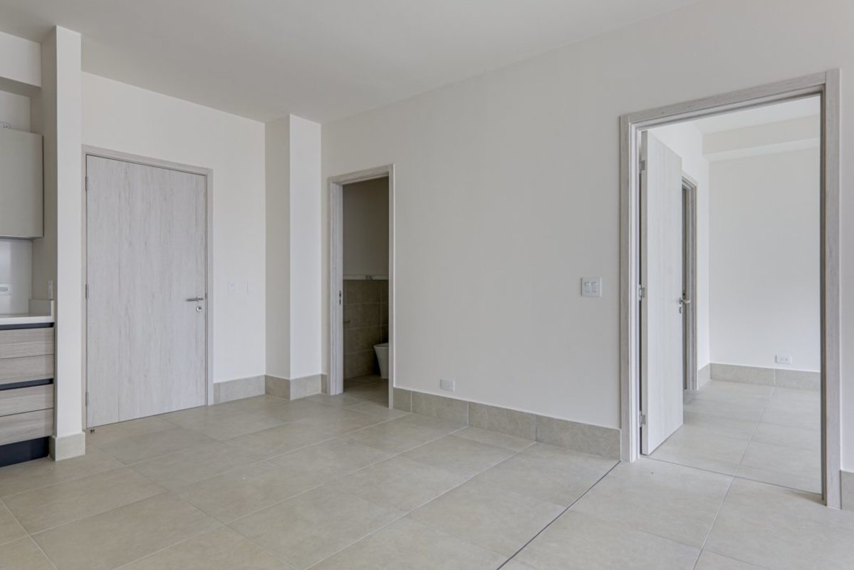 Contemporary kitchen in Ocean House Panama with sleek cabinetry and quartz counters