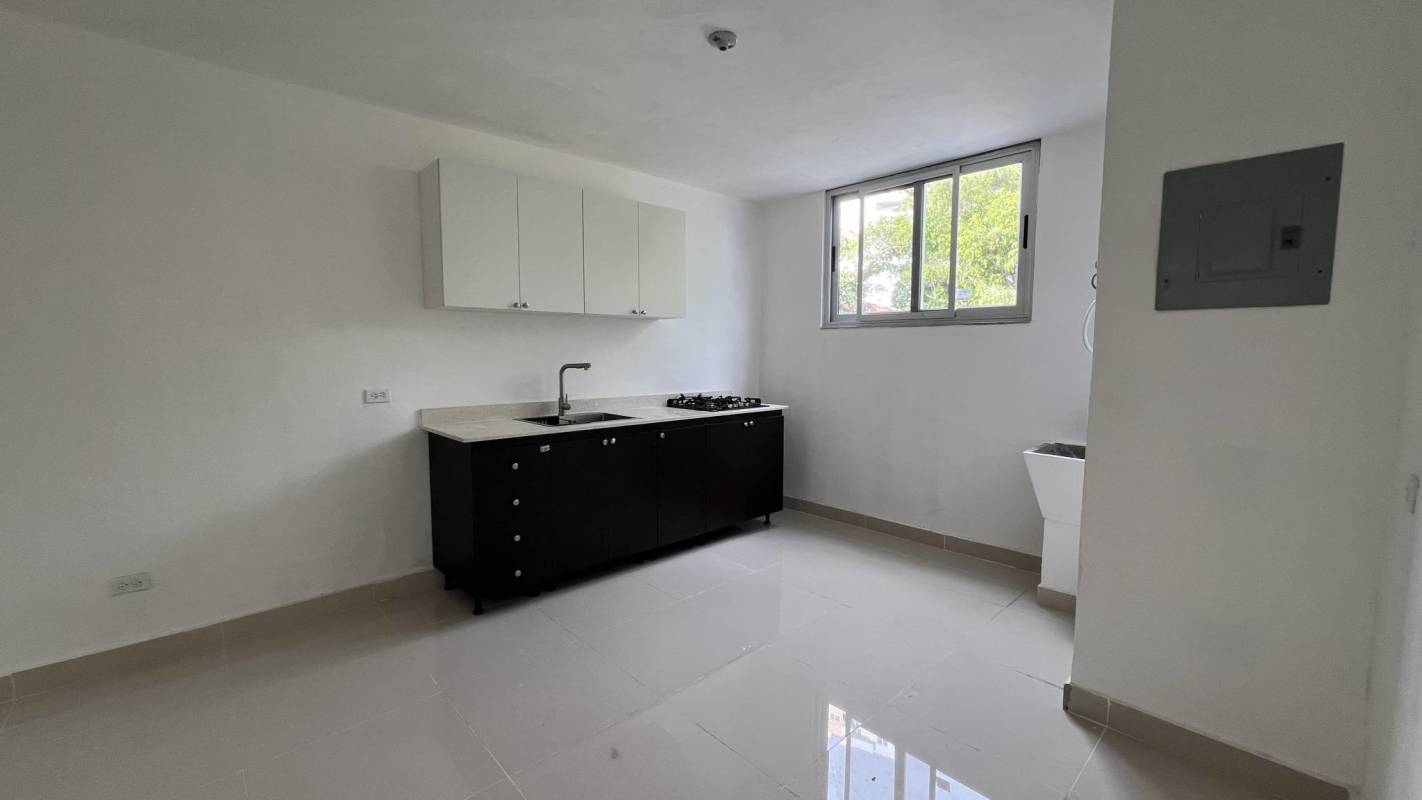 Minimalist kitchen with large window tile floor PH Carrasquilla Residences Panama City
