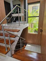 Open plan living dining area with tile floors and large windows PH Nativa Panama