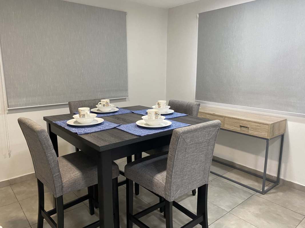Dining room with window towards blue tile kitchen Don Bosco Panama rental house