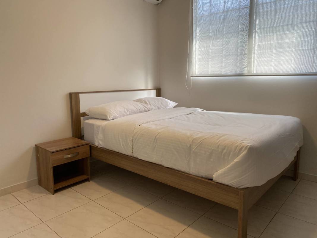Minimalist bedroom with double bed AC and closet in Don Bosco Panama rental