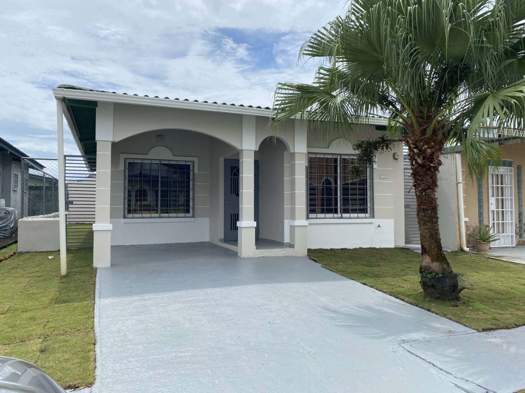 Covered front porch and gated entrance of furnished rental house Don Bosco Panama