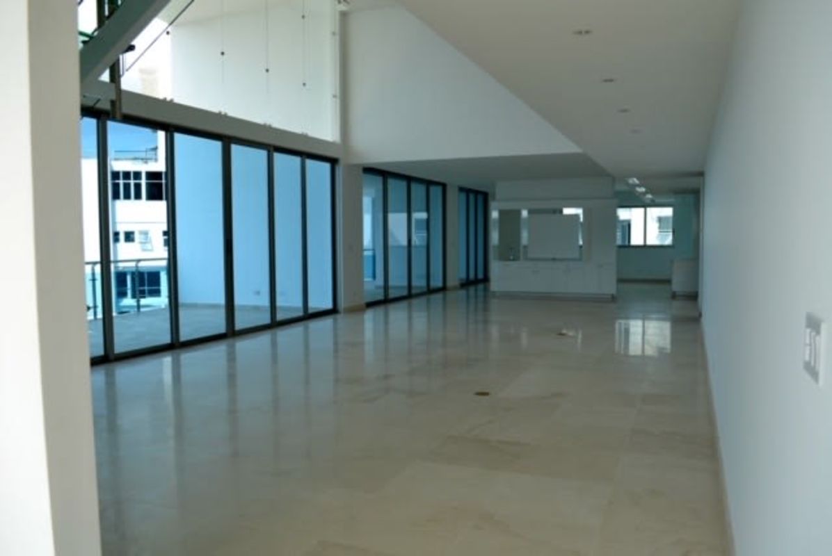 Marble flooring open-plan living space with floor-to-ceiling glass PH Aqualina