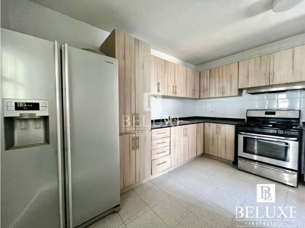 Kitchen with granite counters cabinets and appliances in PH Plaza Real Panama City