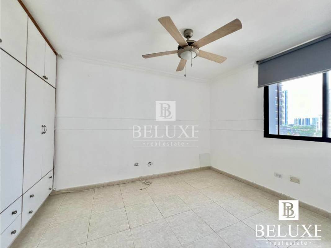 Shared swimming pool surrounded by lounge area in PH Plaza Real Panama City