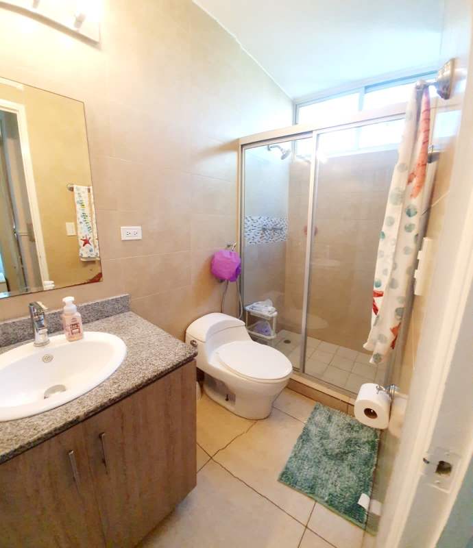 Modern bathroom with granite countertop and glass shower PH Parkside Panama