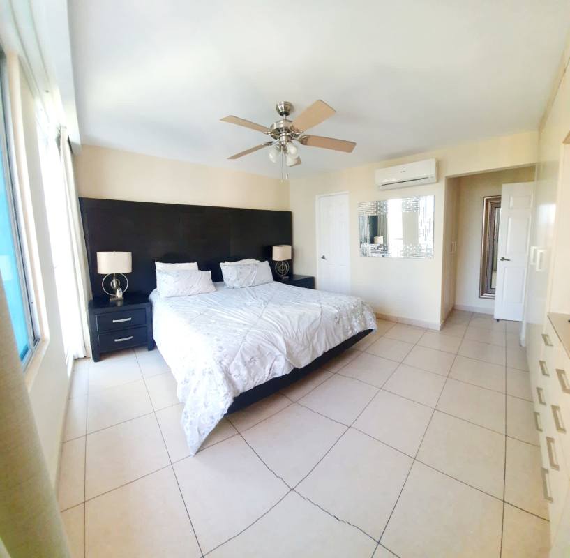 Modern bathroom with glass-enclosed shower granite vanity at PH Parkside Costa del Este