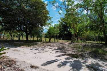 Coastal beachfront land area with clear oceanfront and tropical foliage in Panama