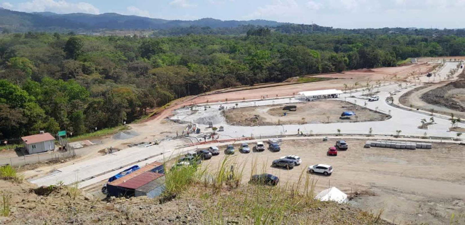 Aerial photo of Porta Norte site showing development land, planned roads, green hills near Brisas del Golf Panama
