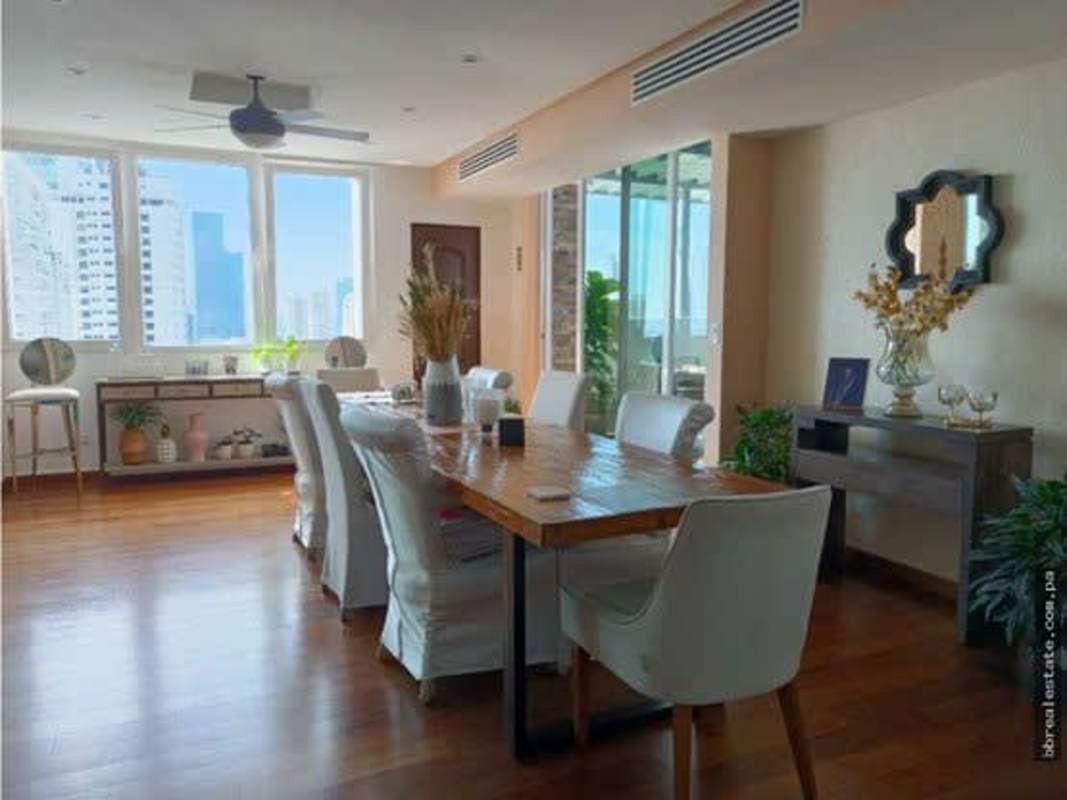 Elegant dining room with city skyline views PH Emporium Tower Penthouse San Francisco Panama