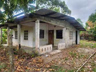 Unfinished small house view of rustic fenced yard in Capira El Cacao Panama