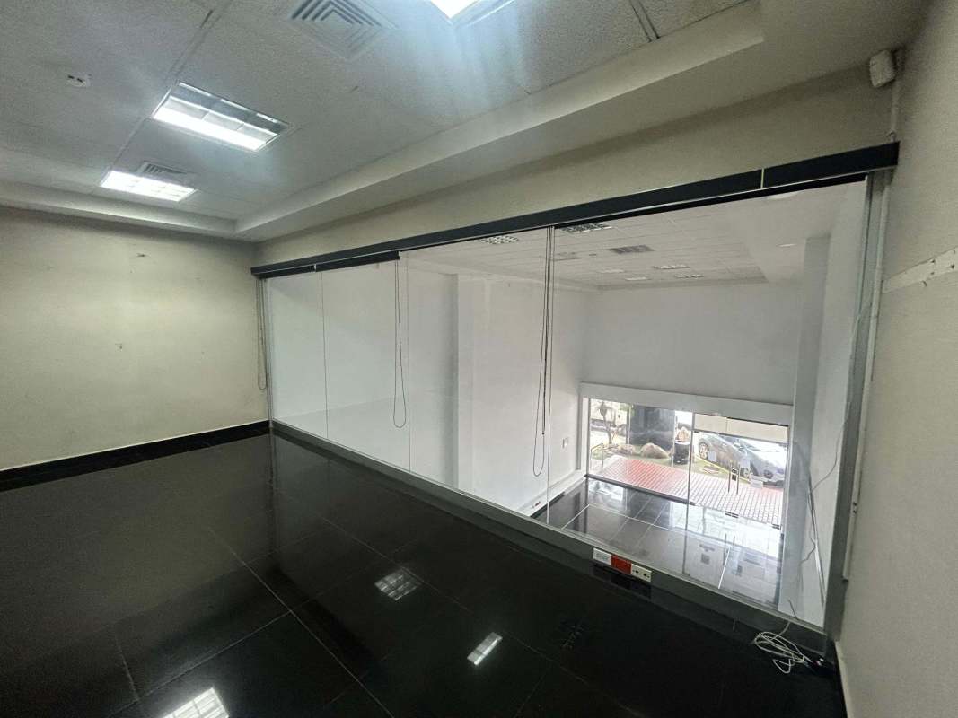 Contemporary tiled bathroom with mirror sink fixtures Plaza El Dorado