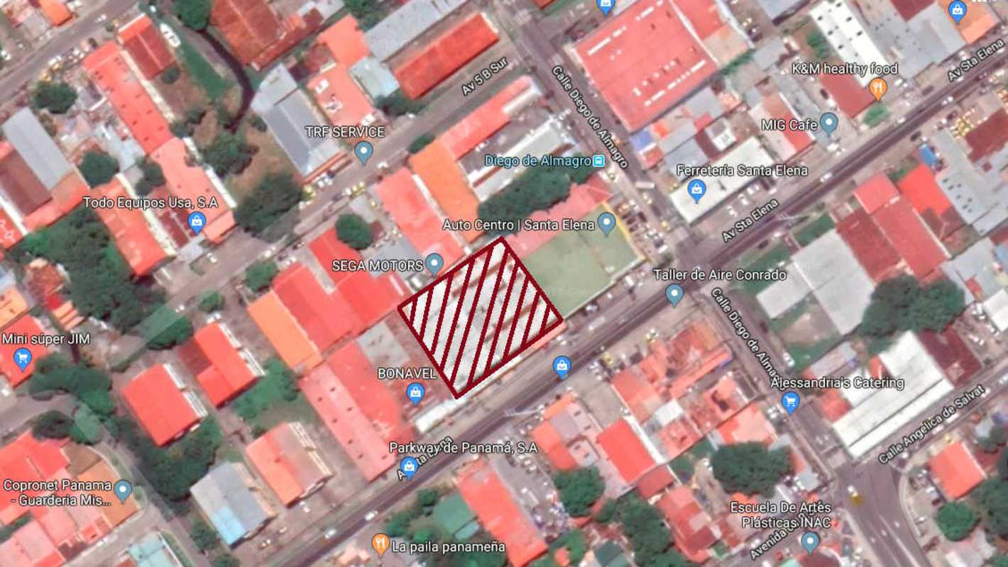 Aerial showing large lot and buildings on busy commercial corridor in Panama City